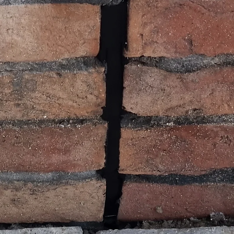 Close-up of a sealed movement joint through brickwork