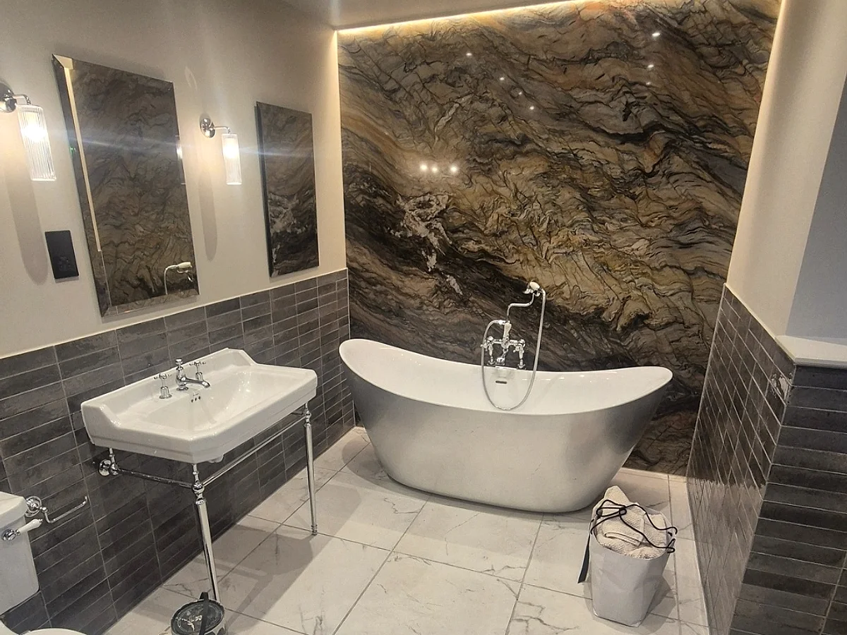 Freestanding bath and marble feature wall, sealed throughout